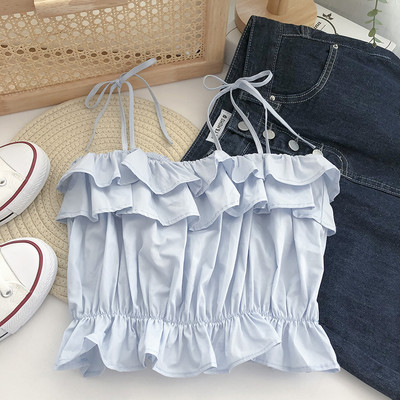 Praegune õhukeste rihmade ja lokkidega topp