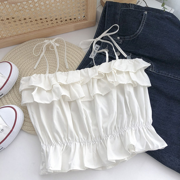 Praegune õhukeste rihmade ja lokkidega topp