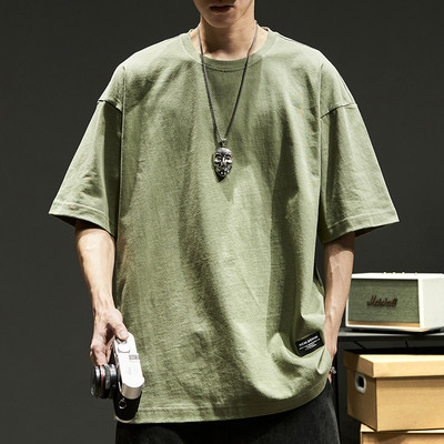 Φαρδύ μπλουζάκι με οβάλ λαιμόκοψη και έμβλημα