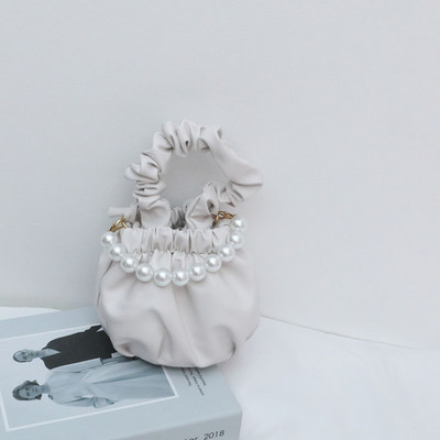 Stiilne lühikeste ja pikkade sangadega ning dekoratiivpärlitega lastekott