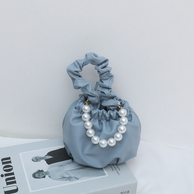 Stiilne lühikeste ja pikkade sangadega ning dekoratiivpärlitega lastekott