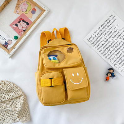 Kaasaegne taskute ja lühikese sangaga laste seljakott