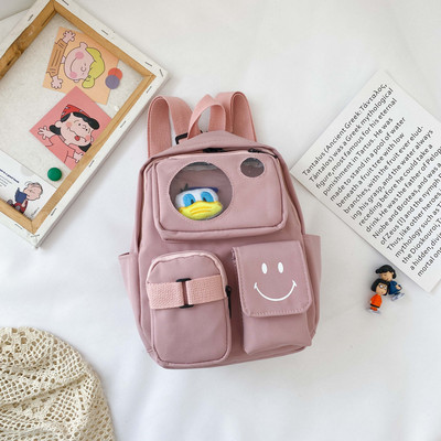 Kaasaegne taskute ja lühikese sangaga laste seljakott