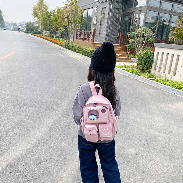 Kaasaegne taskute ja lühikese sangaga laste seljakott