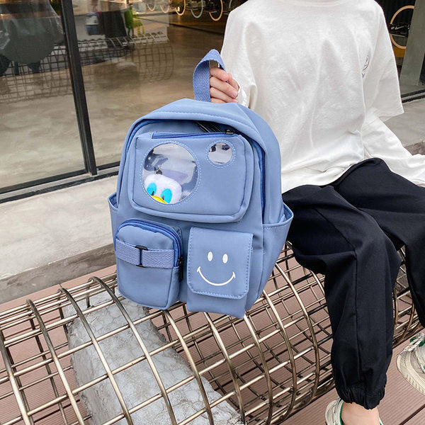 Kaasaegne taskute ja lühikese sangaga laste seljakott