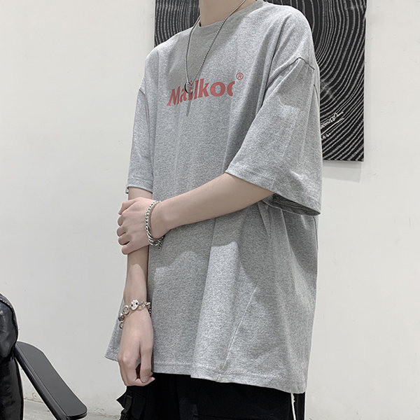 Φαρδύ μοντέλο  μπλουζάκι με επιγραφή και οβάλ λαιμόκοψη