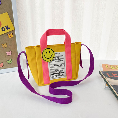 Kaasaegne lastekott lühikese ja pika sangaga ja kirjaga