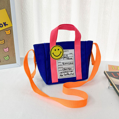 Kaasaegne lastekott lühikese ja pika sangaga ja kirjaga