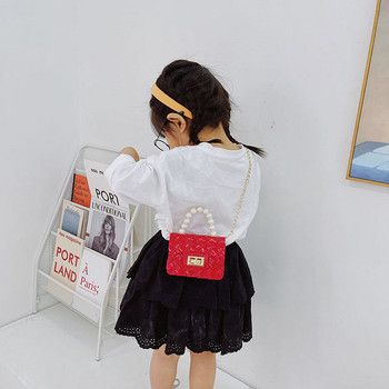 Κομψή μίνι παιδική τσάντα απλό μοντέλο με κοντή και μακριά λαβή