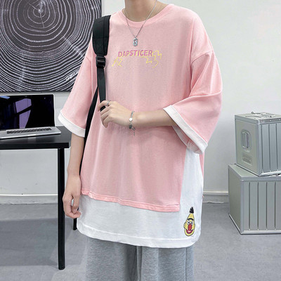 Καλοκαιρινό μπλουζάκι με φαρδύ περικοπή και απλικέ στο πίσω μέρος