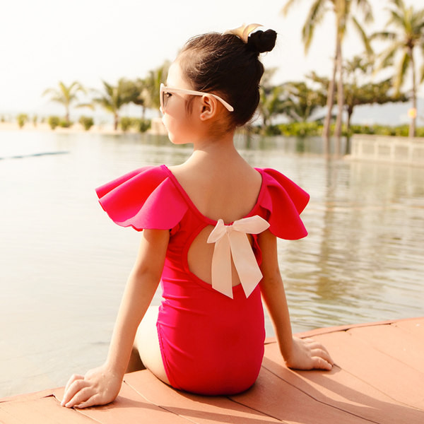 Laste lokkide ja paelaga täisujumistrikoo