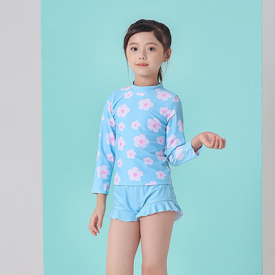 Laste täisujumistrikoo pikkade varrukatega ja aplikatsioonililledega