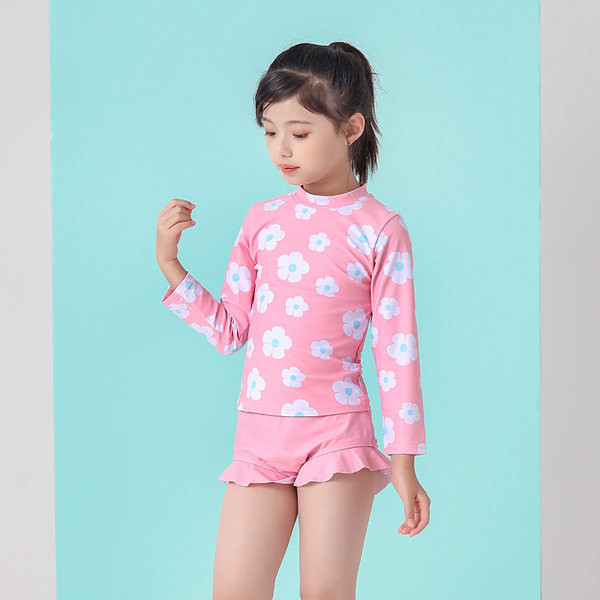 Laste täisujumistrikoo pikkade varrukatega ja aplikatsioonililledega