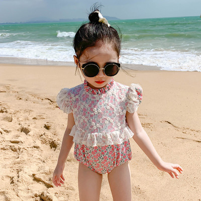 Moekas lokkide ja lillemustriga terve laste ujumistrikoo tüdrukutele