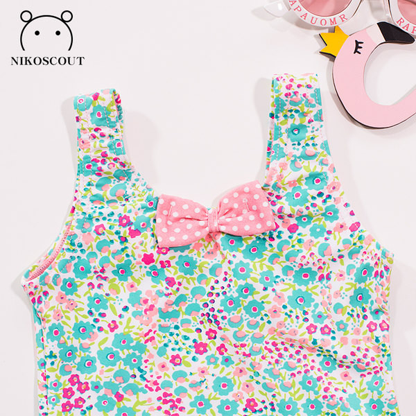 Lillemotiivide ja paelaga terve laste ujumistrikoo