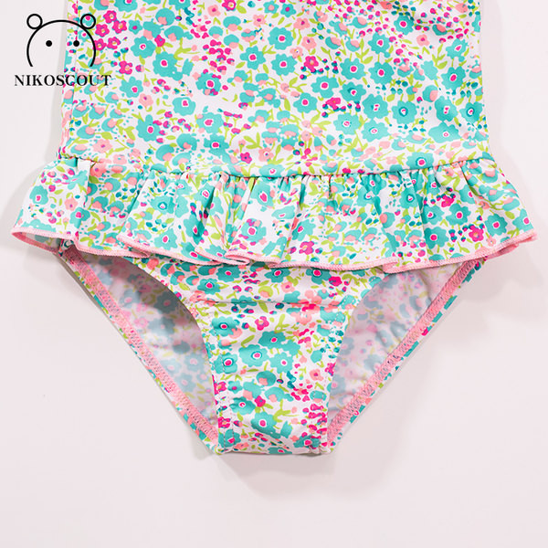 Lillemotiivide ja paelaga terve laste ujumistrikoo