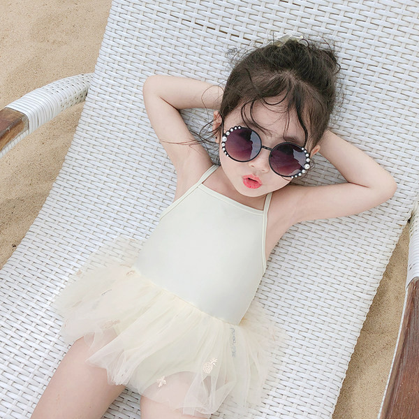 Dječji kupaći kostim s tankim naramenicama i tuljanom suknjom