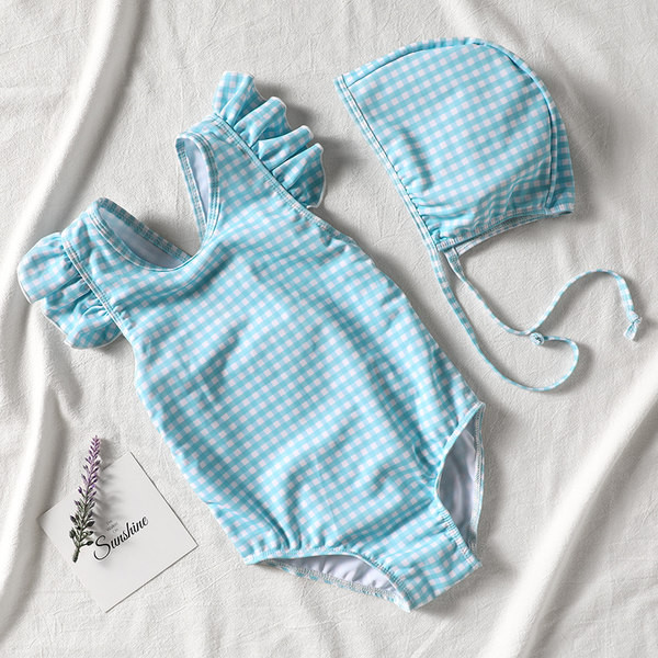 Laste ujumistrikoo seljas ristrihmadega ja lokkidega