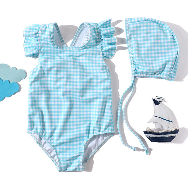 Laste ujumistrikoo seljas ristrihmadega ja lokkidega