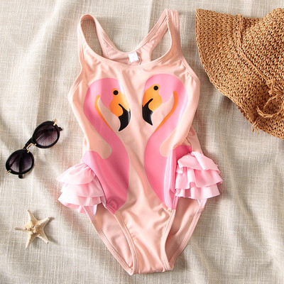 Laste täisujumistrikoo luigeaplikatsiooniga