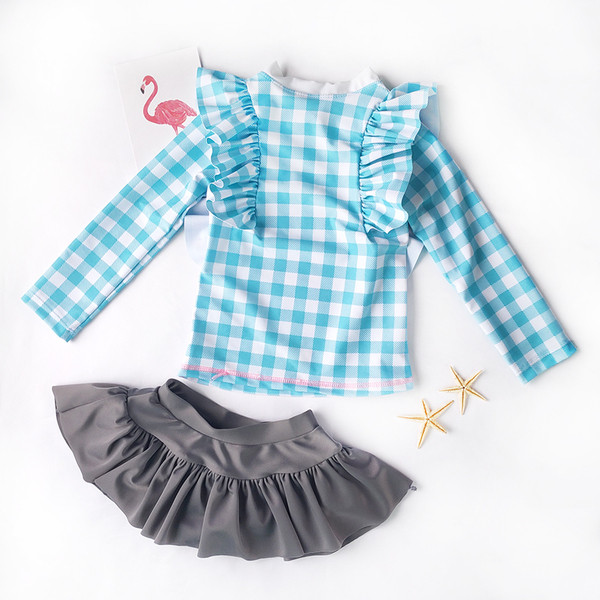 Dječji karirani kupaći kostim iz dva dijela - gornji dio s dugim rukavima