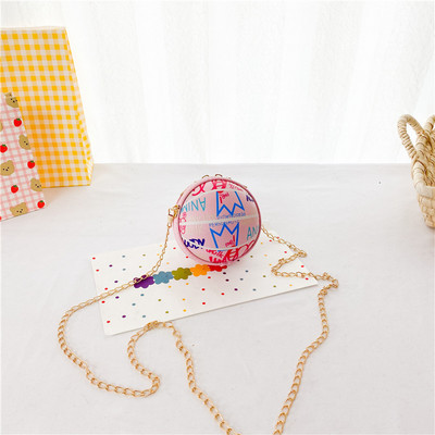 Moderna dječja okrugla mini torba s dugom metalnom ručkom