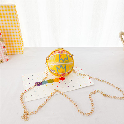 Moderna dječja okrugla mini torba s dugom metalnom ručkom