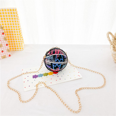 Moderna dječja okrugla mini torba s dugom metalnom ručkom