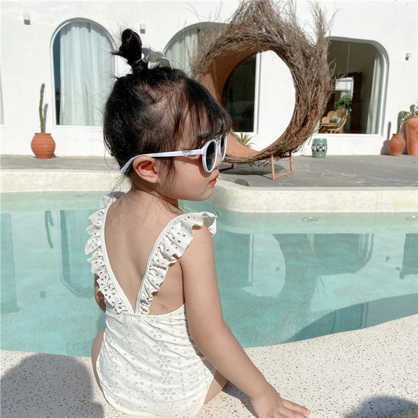 Laste täisujumistrikoo tikandite ja lokkidega