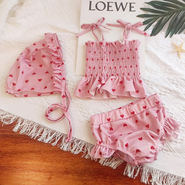 Moodne kaheosaline lokkidega laste ujumistrikoo