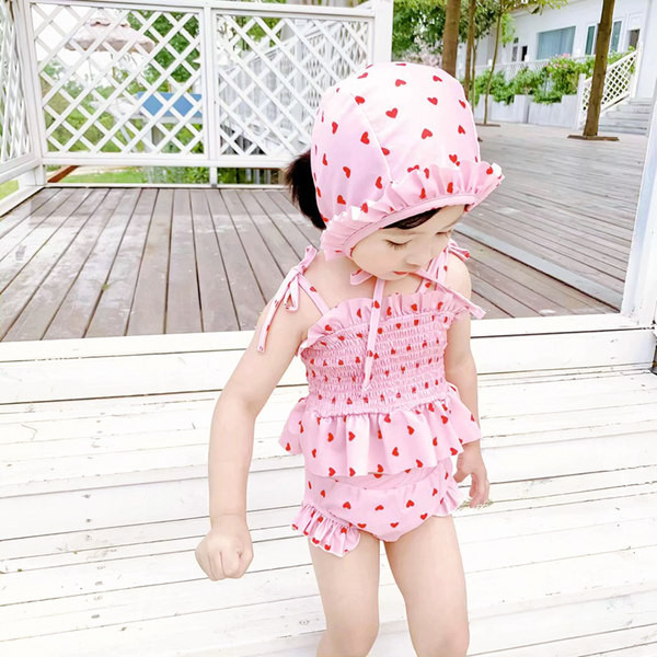 Moodne kaheosaline lokkidega laste ujumistrikoo