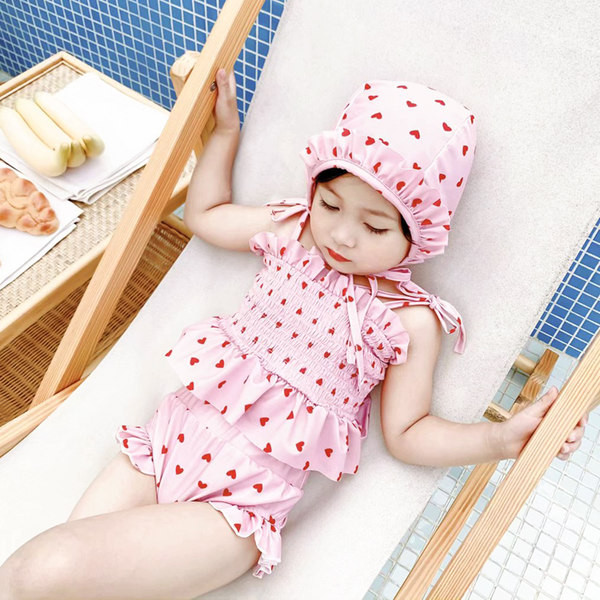 Moodne kaheosaline lokkidega laste ujumistrikoo