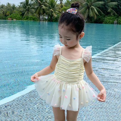 Peenikeste rihmade ja lokkidega laste ujumistrikoo