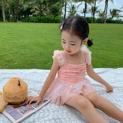 Peenikeste rihmade ja lokkidega laste ujumistrikoo