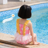 Laste lokkide ja tülliga ujumistrikoo