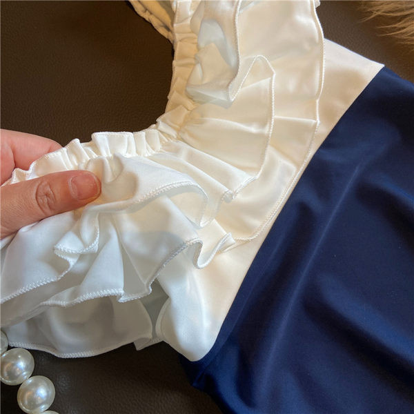 Täielik lokkidega ujumistrikoo tüdrukutele