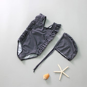 Dječji kupaći kostim na crne točkice