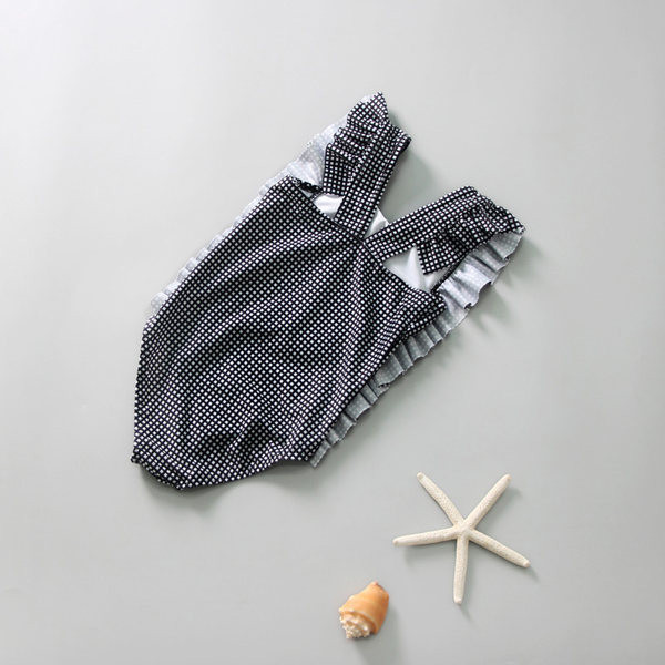 Dječji kupaći kostim na crne točkice
