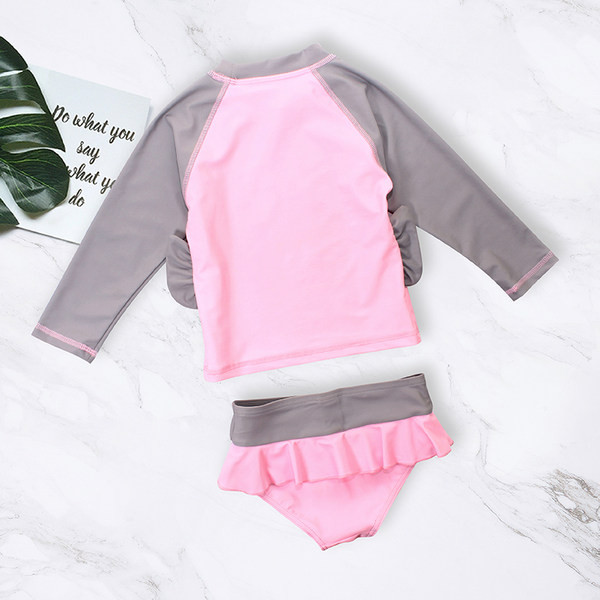 Aplikatsiooni ja pikkade varrukatega laste ujumistrikoo