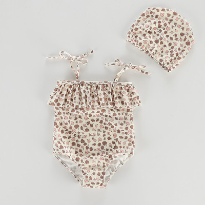 Terve peenikeste rihmade ja lokkidega laste ujumistrikoo