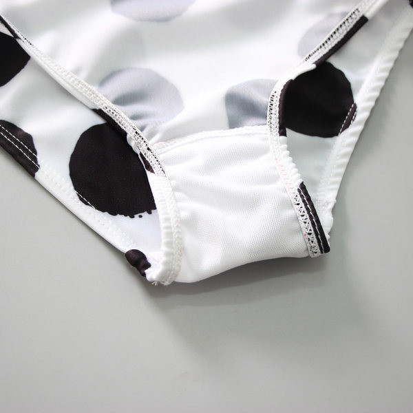 Dječji puni kupaći kostim s točkicama u bijeloj boji