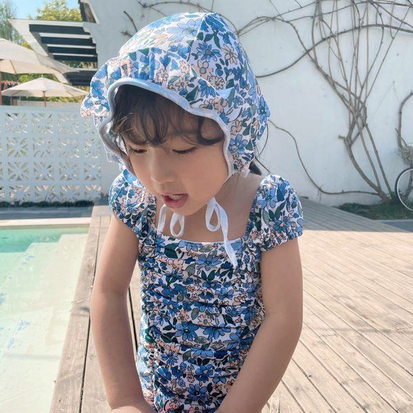 Lühikeste varrukate ja lillemustriga laste ujumistrikoo tüdrukutele