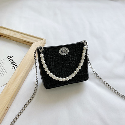 Stiilne kahe sanga ja dekoratiivpärlitega lastekott