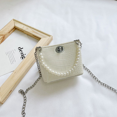 Stiilne kahe sanga ja dekoratiivpärlitega lastekott