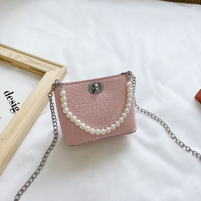 Stiilne kahe sanga ja dekoratiivpärlitega lastekott