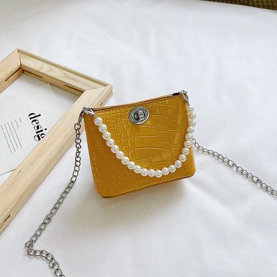 Stiilne kahe sanga ja dekoratiivpärlitega lastekott