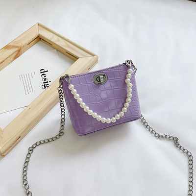 Stiilne kahe sanga ja dekoratiivpärlitega lastekott