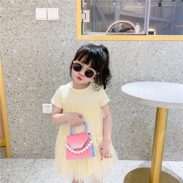 Dječja mini torbica s ukrasnim perlama i dvije ručke