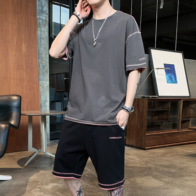 Vīriešu divdaļīgā komanda ar uzrakstu