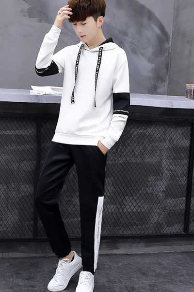 Kahest osast koosnev meeste meeskond, millel on pikkade varrukate kiri ja lipsud